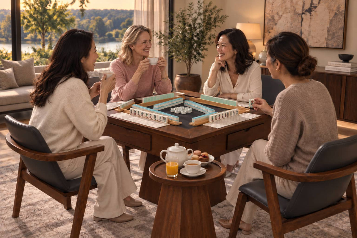 Friends enjoying a relaxed afternoon of American Mahjong and tea around an AURAJONG automatic mahjong table