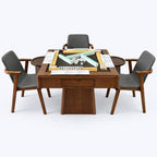 Front view of the AURAJONG R1 automatic American Mahjong table in black walnut color with Sightline Racks, NMJL cards, tiles, chairs, and side tables