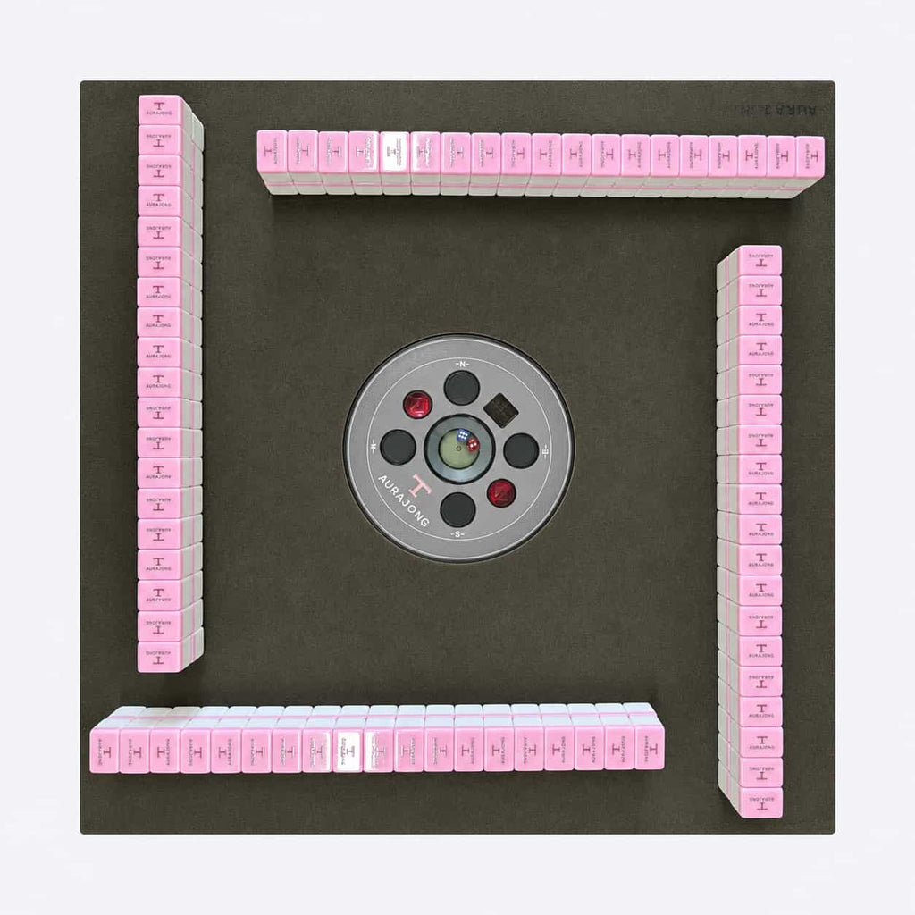 Top view of the AURAJONG R1 automatic American Mahjong table with pink American Mahjong tiles