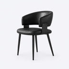 AURAJONG R4 black upholstered Mahjong chair with curved backrest and slim black legs.