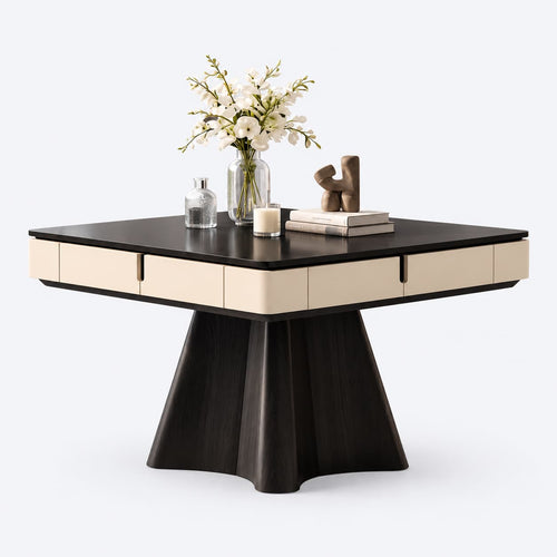 AURAJONG R4 ivory and black automatic American Mahjong table with dining cover, sculptural pedestal base, and styled tabletop decor.