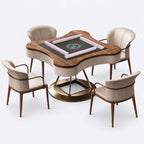AURAJONG S2 automatic American Mahjong table with four cream white chairs, gray play surface, pink Mahjong tiles, North American black walnut frame, and a brass-tone stainless steel and clear acrylic base.
