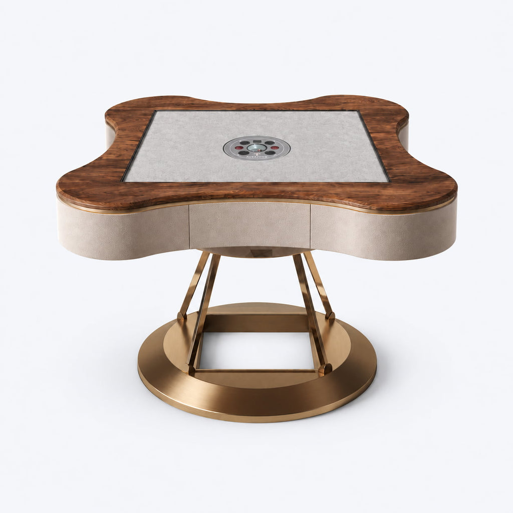 AURAJONG S2 automatic American Mahjong table with a North American black walnut dining cover, cream white top-grain leather body, and a base combining brass-tone stainless steel and clear acrylic.