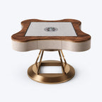 AURAJONG S2 automatic American Mahjong table with a North American black walnut dining cover, cream white top-grain leather body, and a base combining brass-tone stainless steel and clear acrylic.