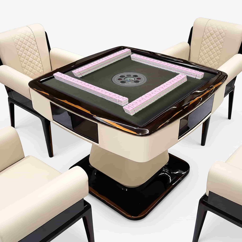 AURAJONG S3 luxury automatic American Mahjong table with pink Mahjong tiles, dark gray play surface, cream top-grain leather body, and matching upholstered chairs.