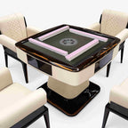 AURAJONG S3 luxury automatic American Mahjong table with pink Mahjong tiles, dark gray play surface, cream top-grain leather body, and matching upholstered chairs.