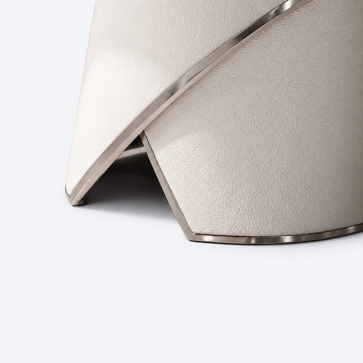 Close-up detail of the AURAJONG S4 automatic American Mahjong table base in ivory upholstery with metal trim.