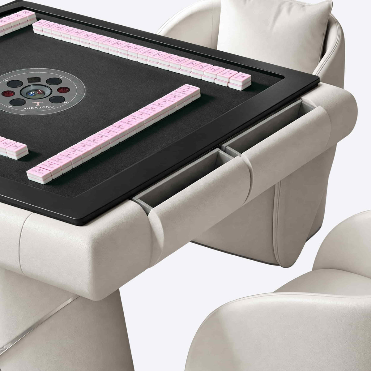Detail view of the AURAJONG S4 automatic American Mahjong table drawers in ivory with grey play surface and pink tiles.