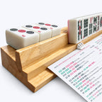 Side view of the AURAJONG Sightline Rack with an NMJL card temporarily secured in place and American Mahjong tiles resting on the rack