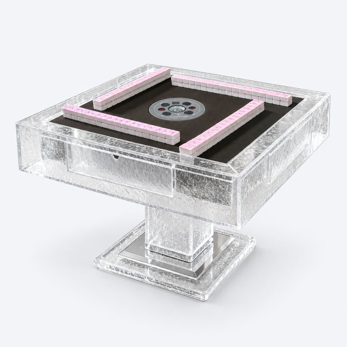 AURAJONG T2 clear acrylic automatic American Mahjong table with a dark playing surface, pink Mahjong tiles, and a sculptural pedestal base