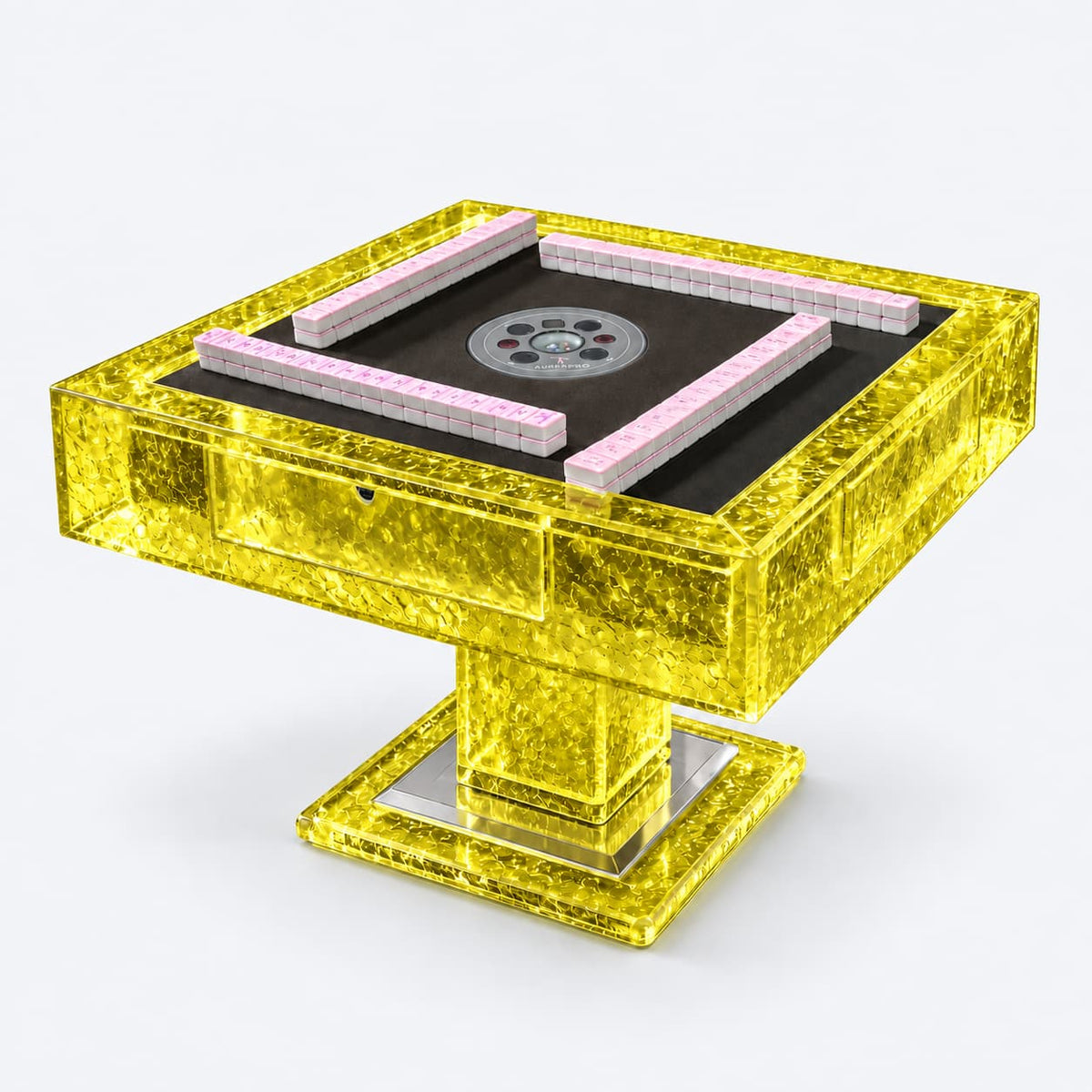 AURAJONG T2 automatic American Mahjong table crafted from translucent yellow acrylic with a sculptural pedestal base and pink Mahjong tiles