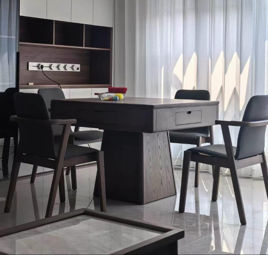 AURAJONG R1 automatic American Mahjong table in a modern apartment with dark wood finish and four matching chairs