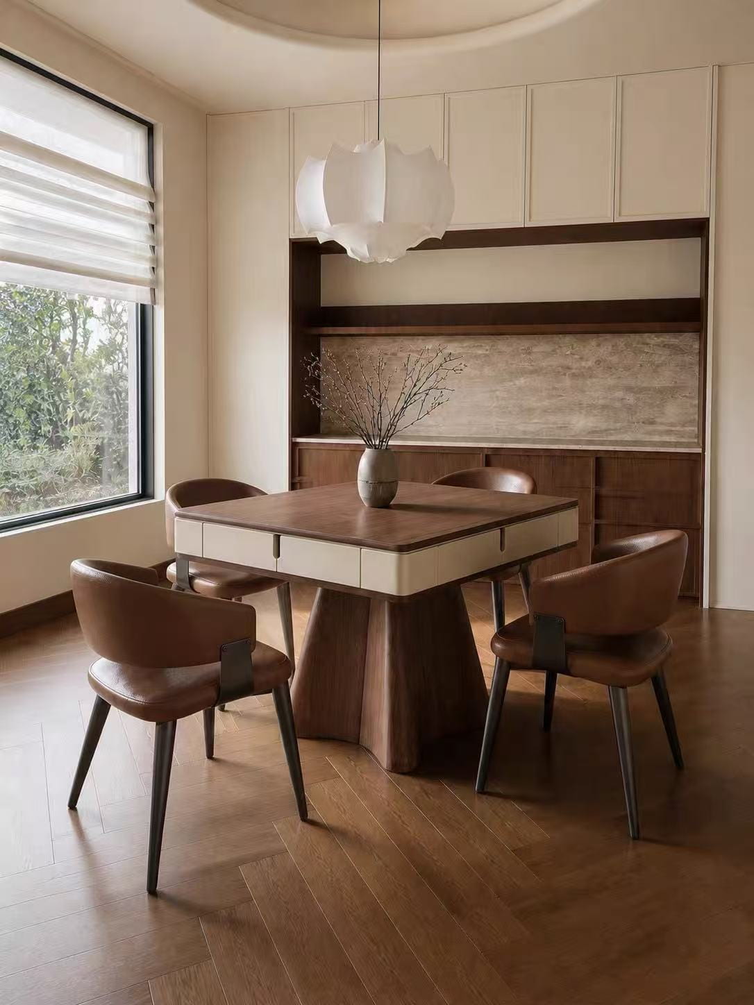 AURAJONG R4 automatic American Mahjong table with walnut top and ivory finish in a warm dining room with four leather chairs