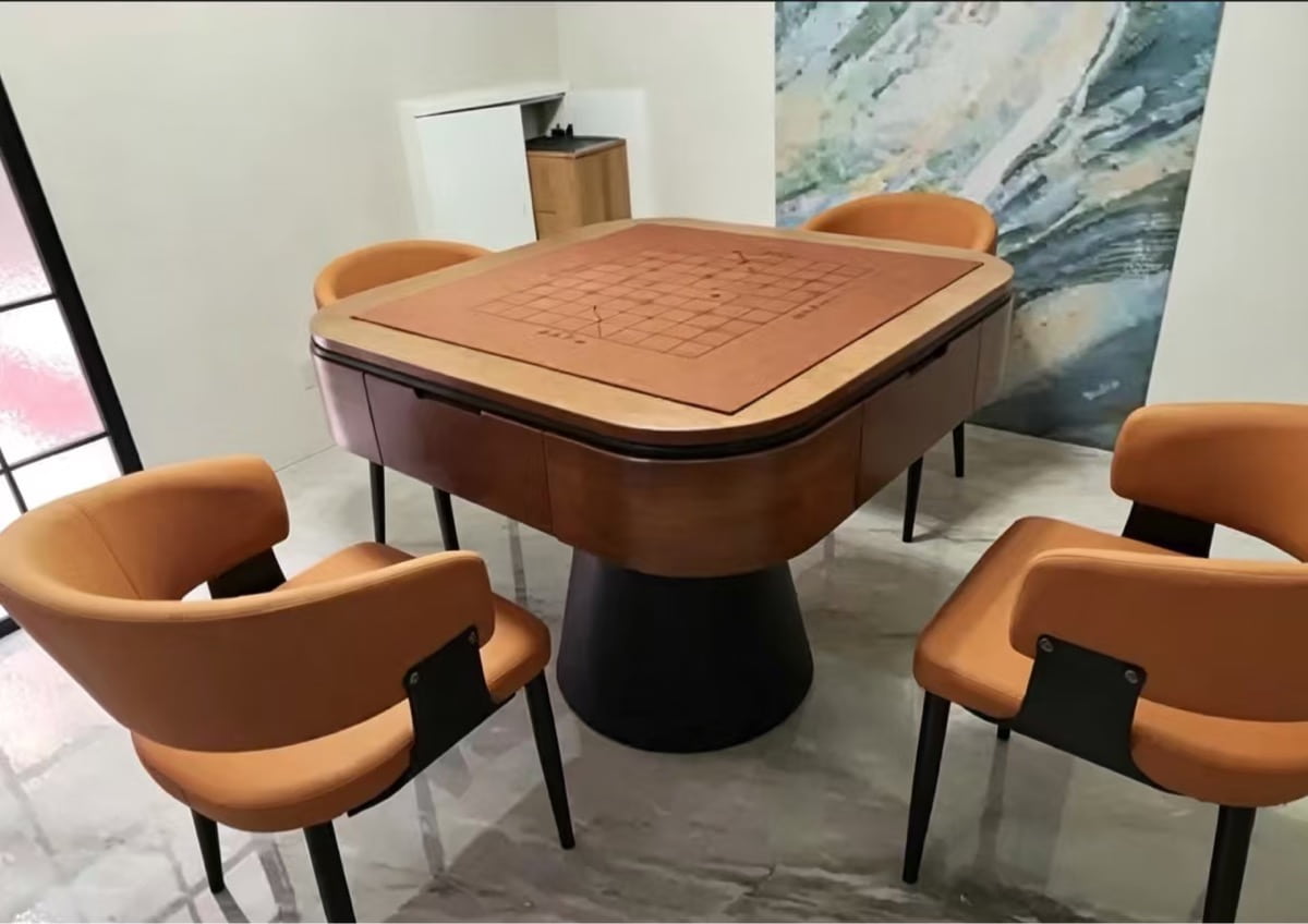 AURAJONG R5 automatic American Mahjong table with exposed Mahjong play surface in a modern home with four brown upholstered chairs