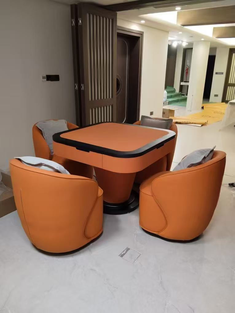 AURAJONG S1 automatic American Mahjong table with orange finish and four matching upholstered lounge chairs in a modern home interior