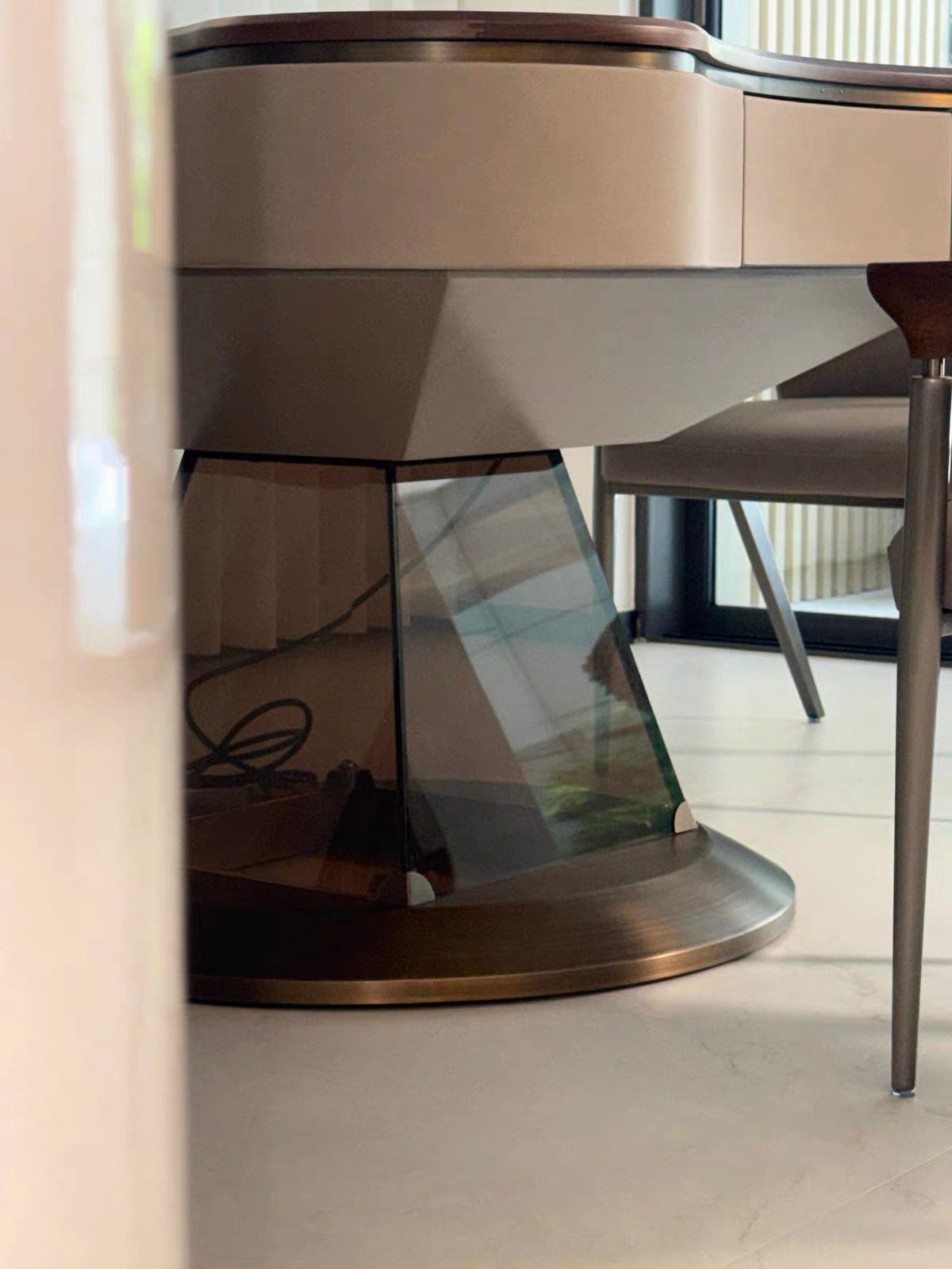 Detail view of the AURAJONG S2 automatic American Mahjong table showing the sculptural smoky pedestal base and upholstered seating