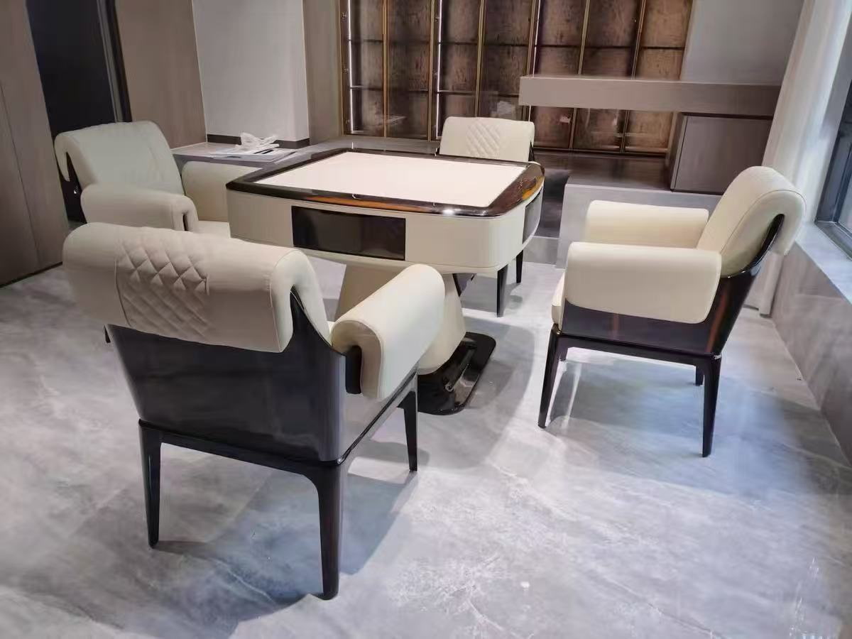 AURAJONG S3 automatic American Mahjong table with closed top and four cream upholstered chairs in a refined modern interior